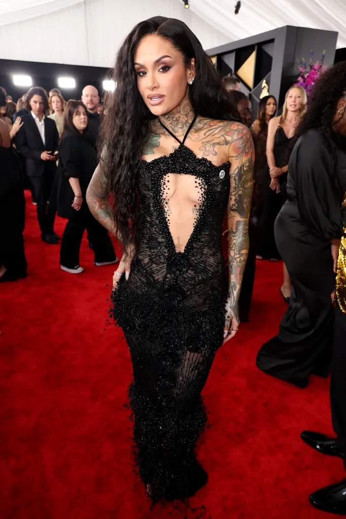 Kehlani in a black beaded gown with a plunging neckline on the red carpet at the 68th GRAMMY Awards.