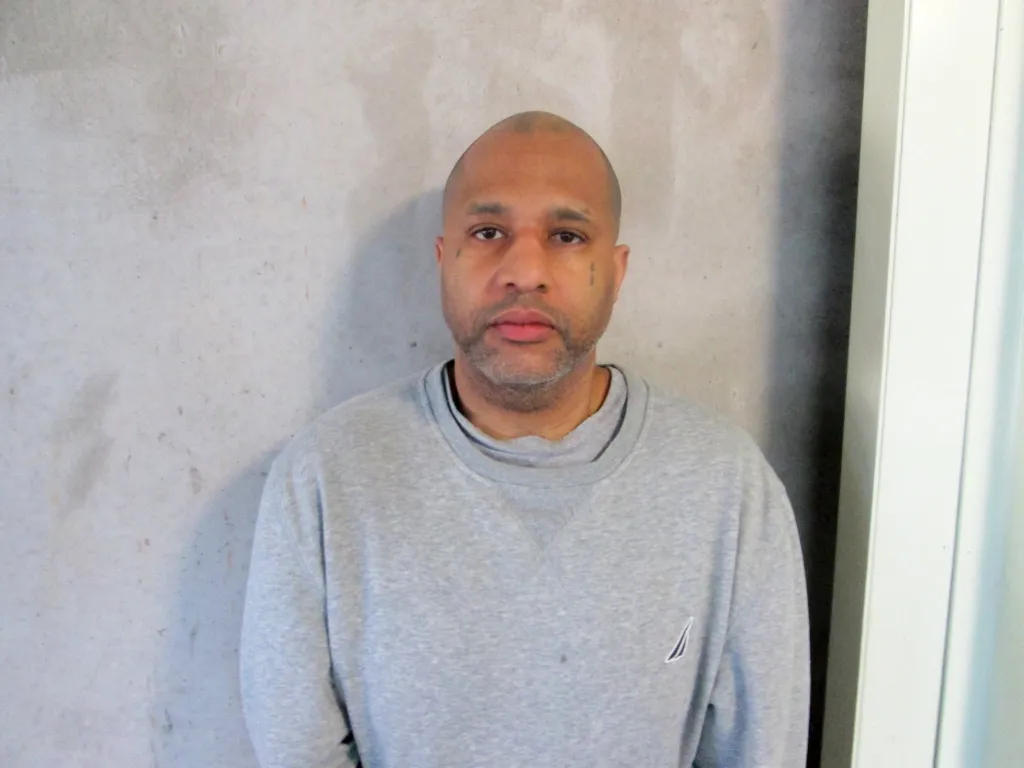 Kendrick Simpson, a bald man with a short gray beard, is pictured in a mugshot.
