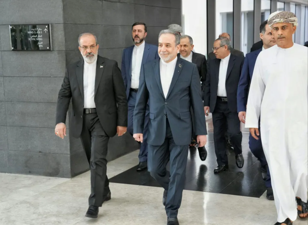 Iranian Foreign Minister Abbas Araghchi, center, heading to talks between Iran and the U.S. in Muscat, Oman.