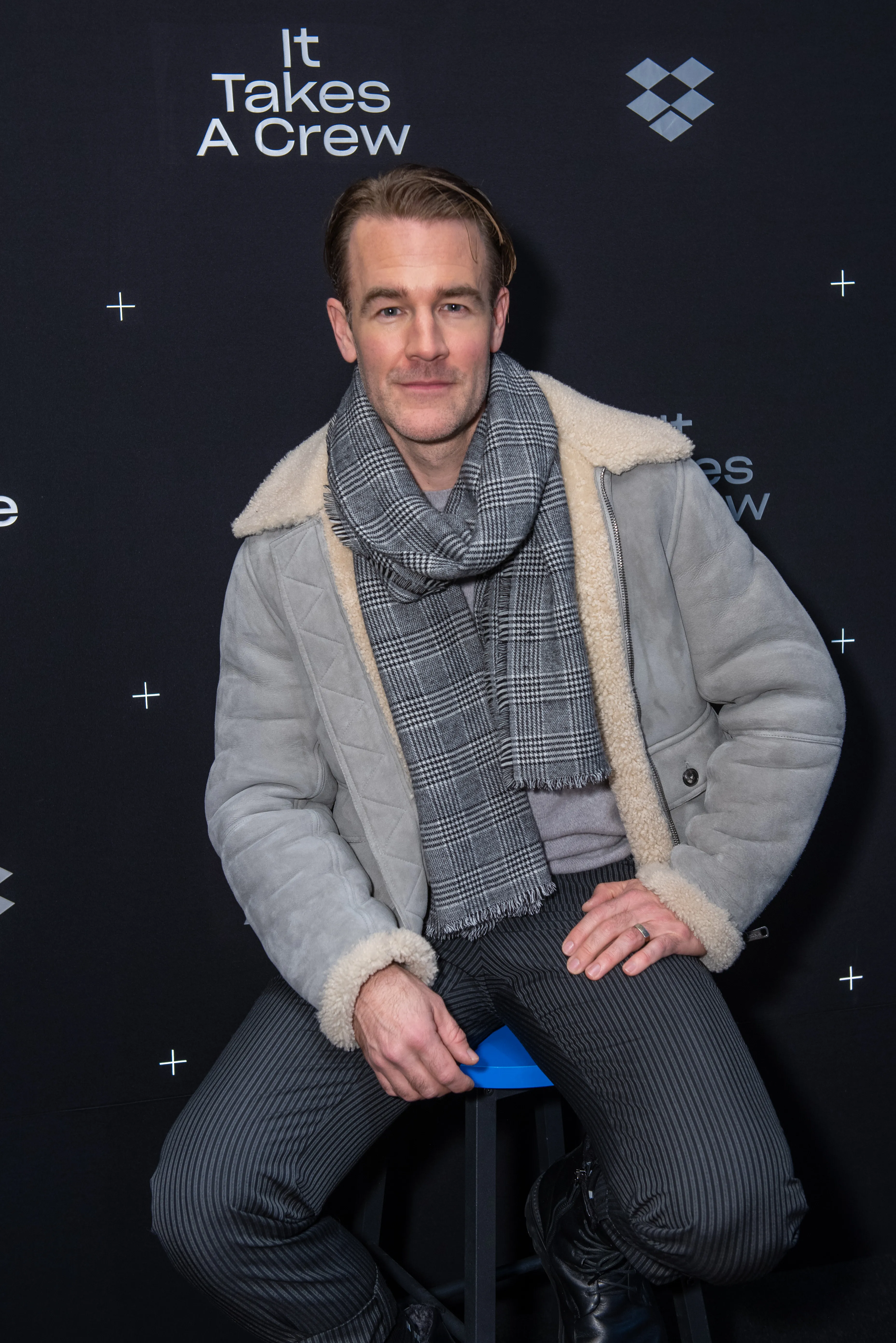 Actor James Van Der Beek sitting in front of a dark background with white text 