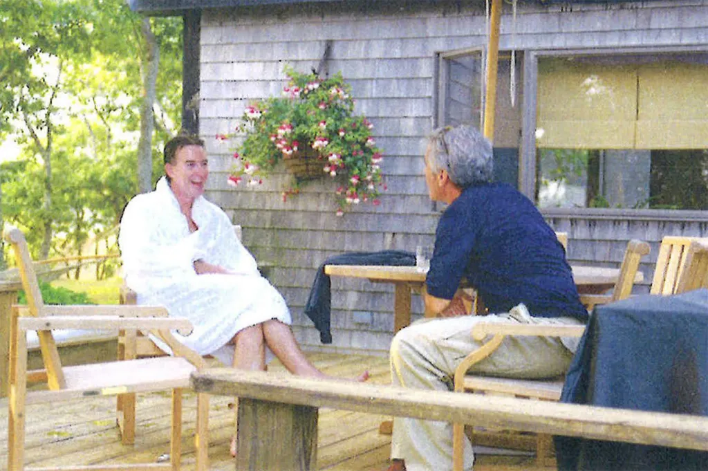 Peter Mandelson wearing a bathrobe while talking to Jeffrey Epstein.