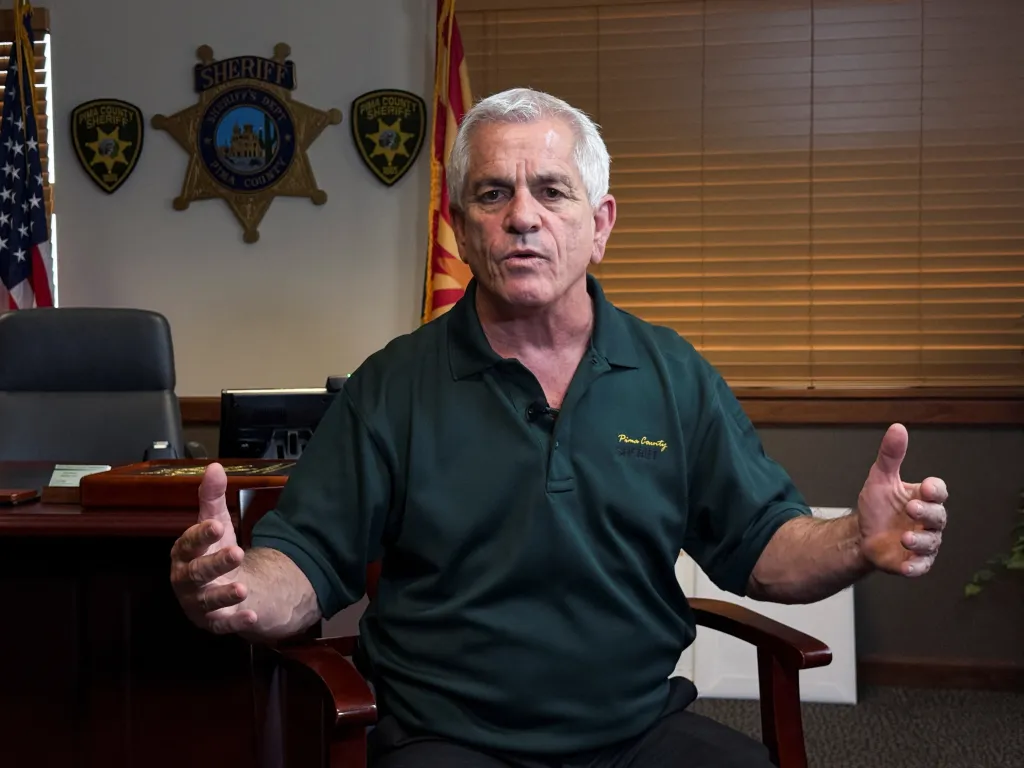 Pima County Sheriff Chris Nanos gestures during an interview.
