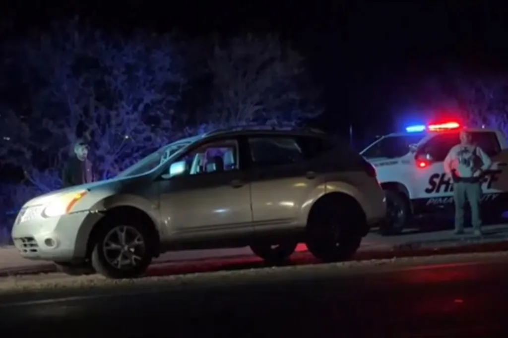Police investigate a car stopped by officers in Arizona on Feb. 10, 2026.