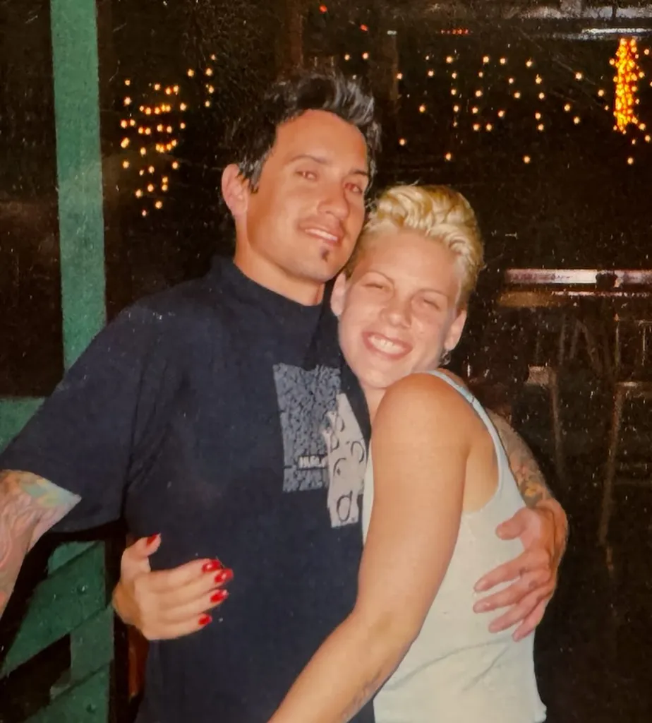 Pink and Carey Hart embracing.