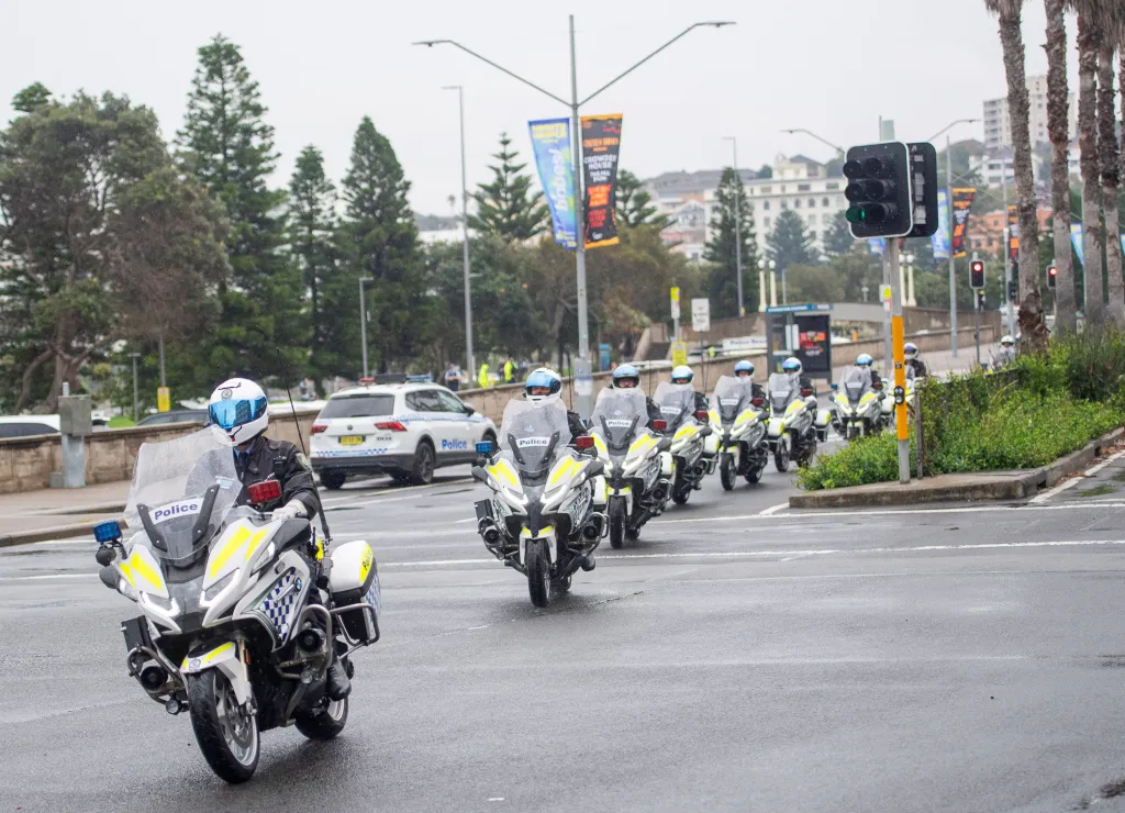 Police ride on bikes outside Bondi Pavilion during a wreath laying ceremony attended by Israeli President Isaac Herzog