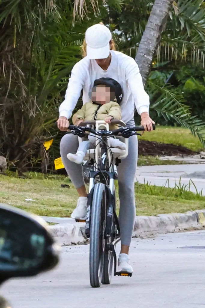 Gisele Bundchen on a bike with her 1-year-old son, River.