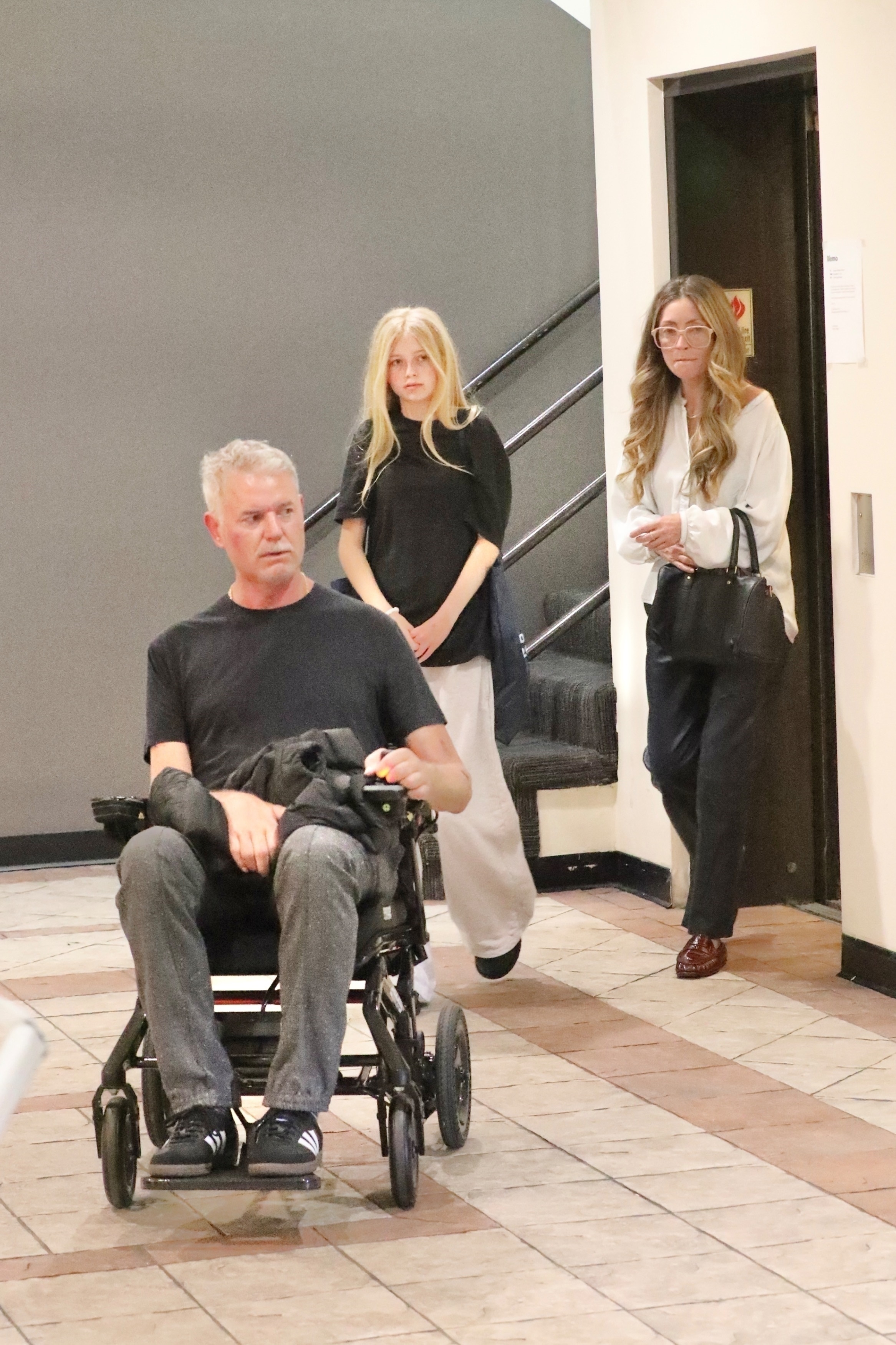 Eric Dane in a wheelchair with Rebecca Gayheart and daughter Georgia.