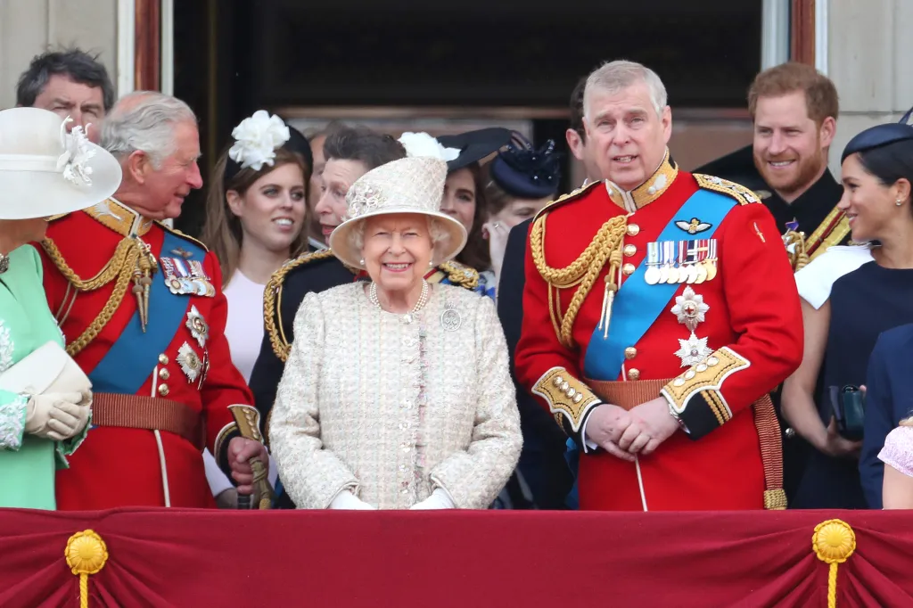 Queen Elizabeth II, Prince Charles, Princess Beatrice, Princess Anne, Prince Andrew, Prince Harry, and Meghan Markle on a balcony during Trooping the Colour.