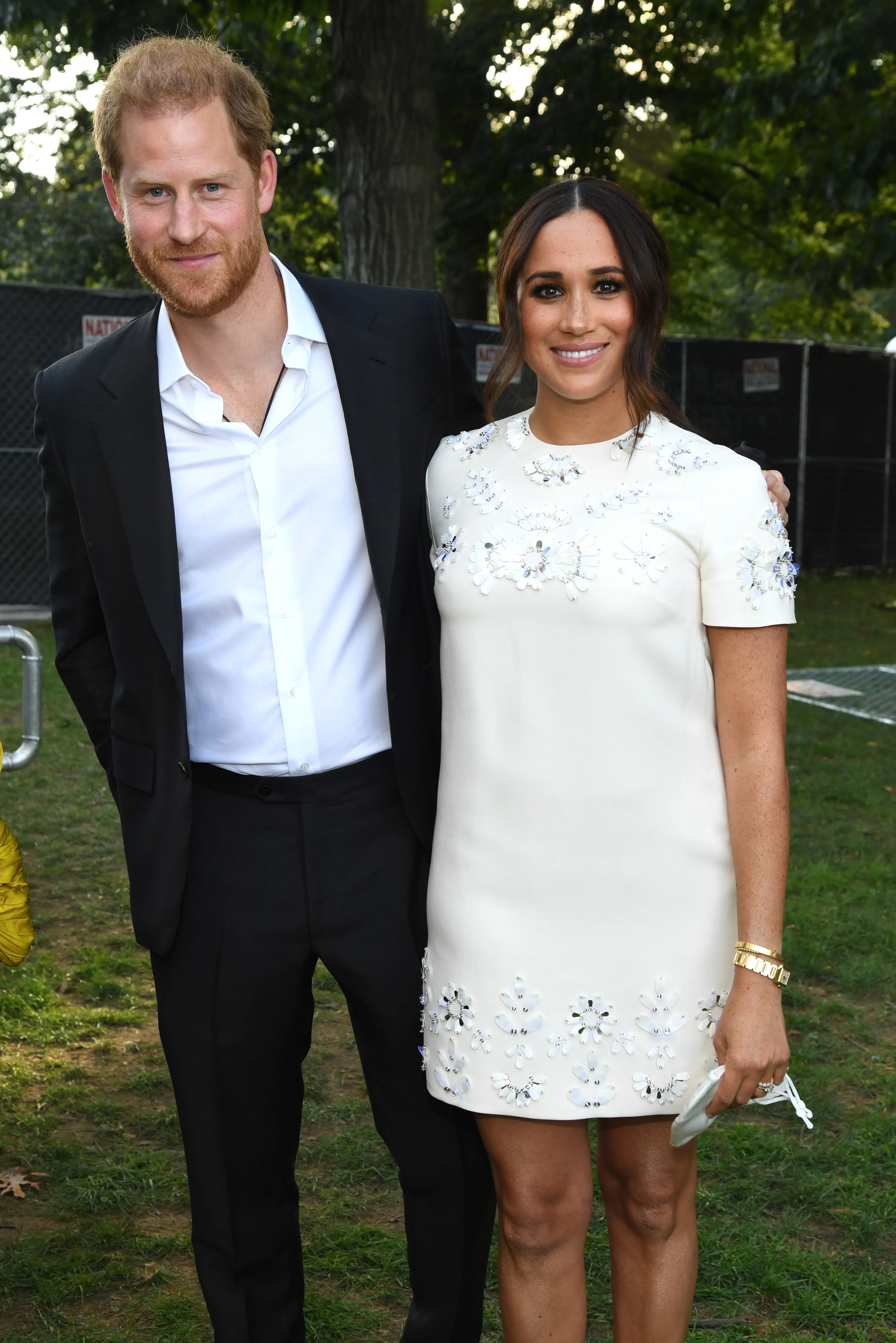 Prince Harry and Meghan Markle pose together.