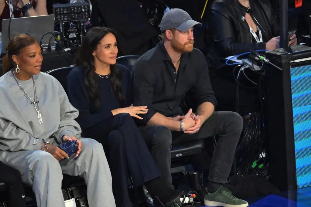 Queen Latifah, Megan Markle, and Prince Harry seated courtside at the 75th NBA All-Star Game.