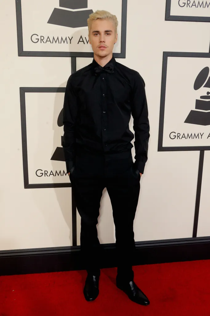 Justin Bieber on a red carpet at the 58th GRAMMY Awards.