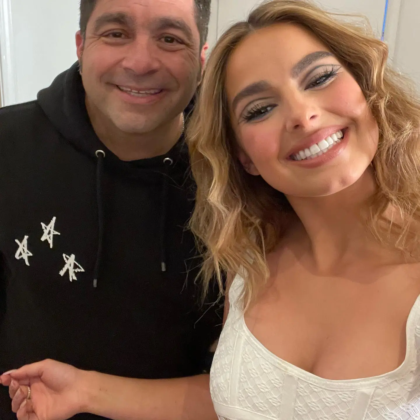 Addison Rae and her father, Monty Lopez, posing for a photo.