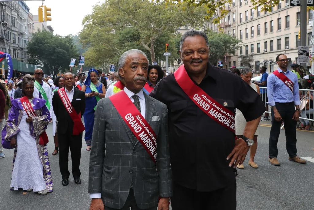 Al Sharpton and Jesse Jackson marching as Grand Marshals in the African American Day Parade.
