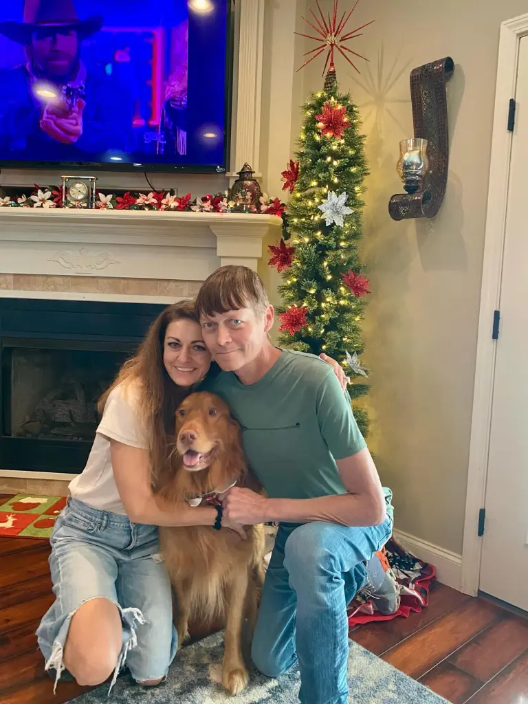 Brad Arnold shared the snap on Boxing Day, showing a happy moment with his wife Jennifer and their pet pooch in front of their Christmas tree.