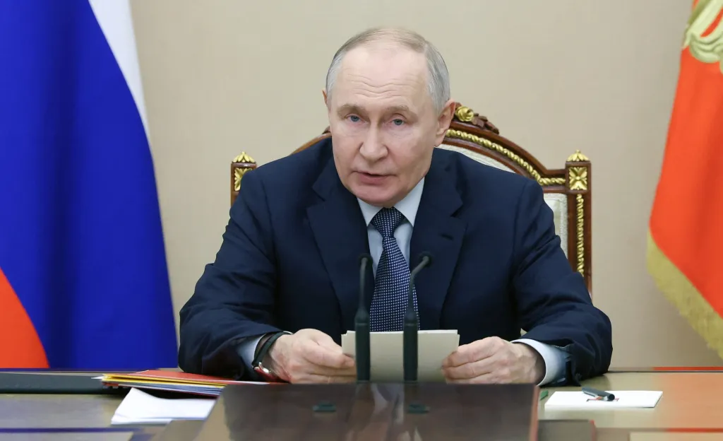 Russian President Putin chairs a meeting.