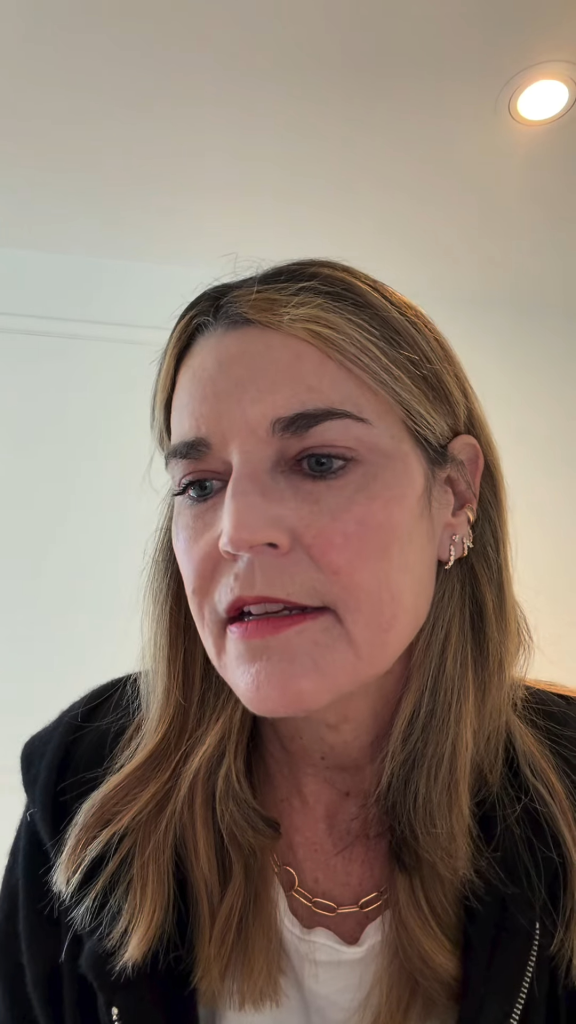 Savannah Guthrie looking down, speaking.