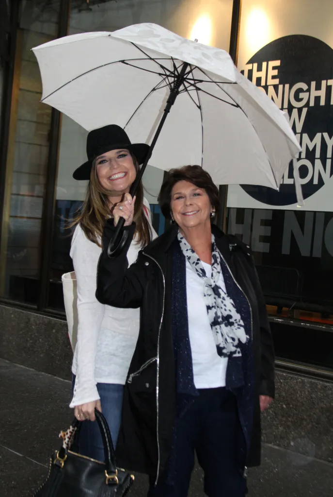 Savannah Guthrie and her mom pose with an umbrella.