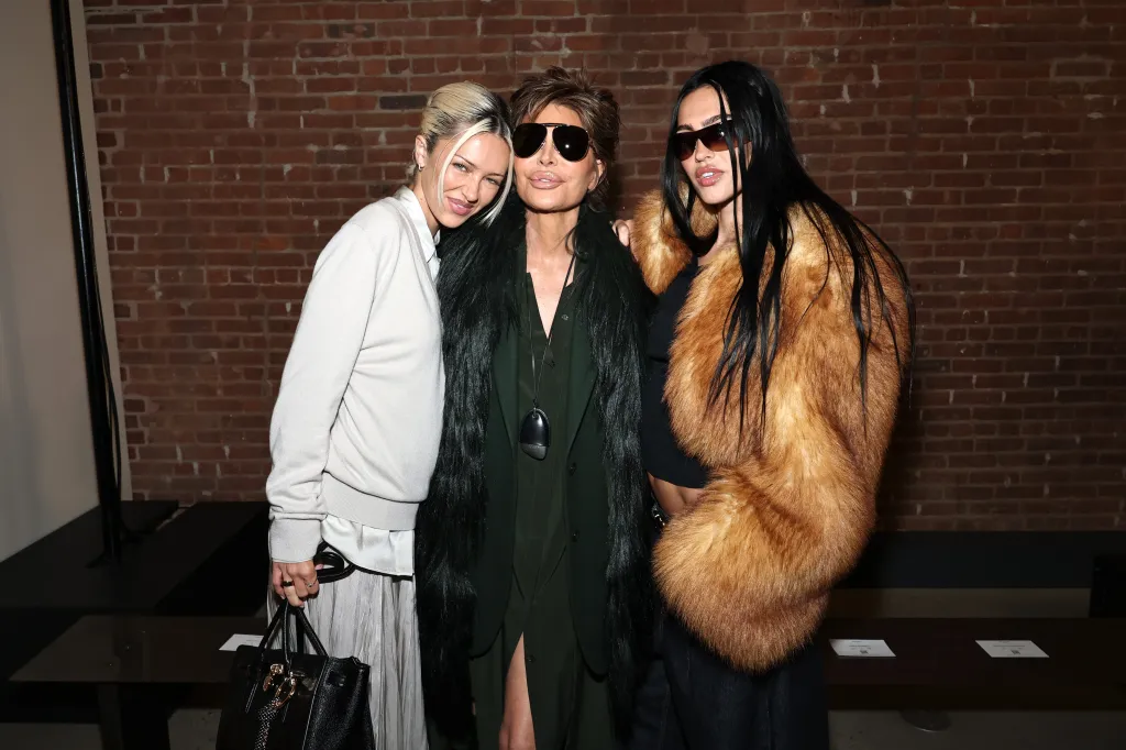 Delilah Belle Hamlin, Lisa Rinna, and Amelia Gray Hamlin pose for a photo at a fashion show.