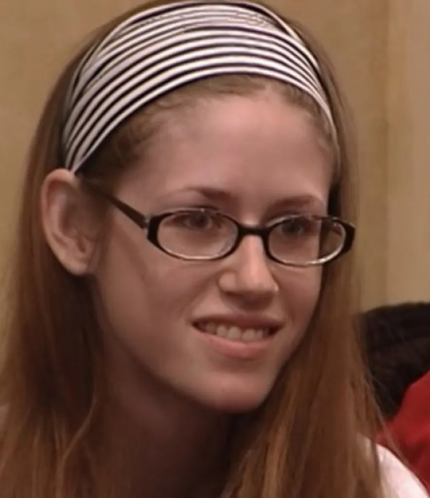 Shandi Sullivan, contestant on America's Next Top Model, wearing a striped headband and glasses.