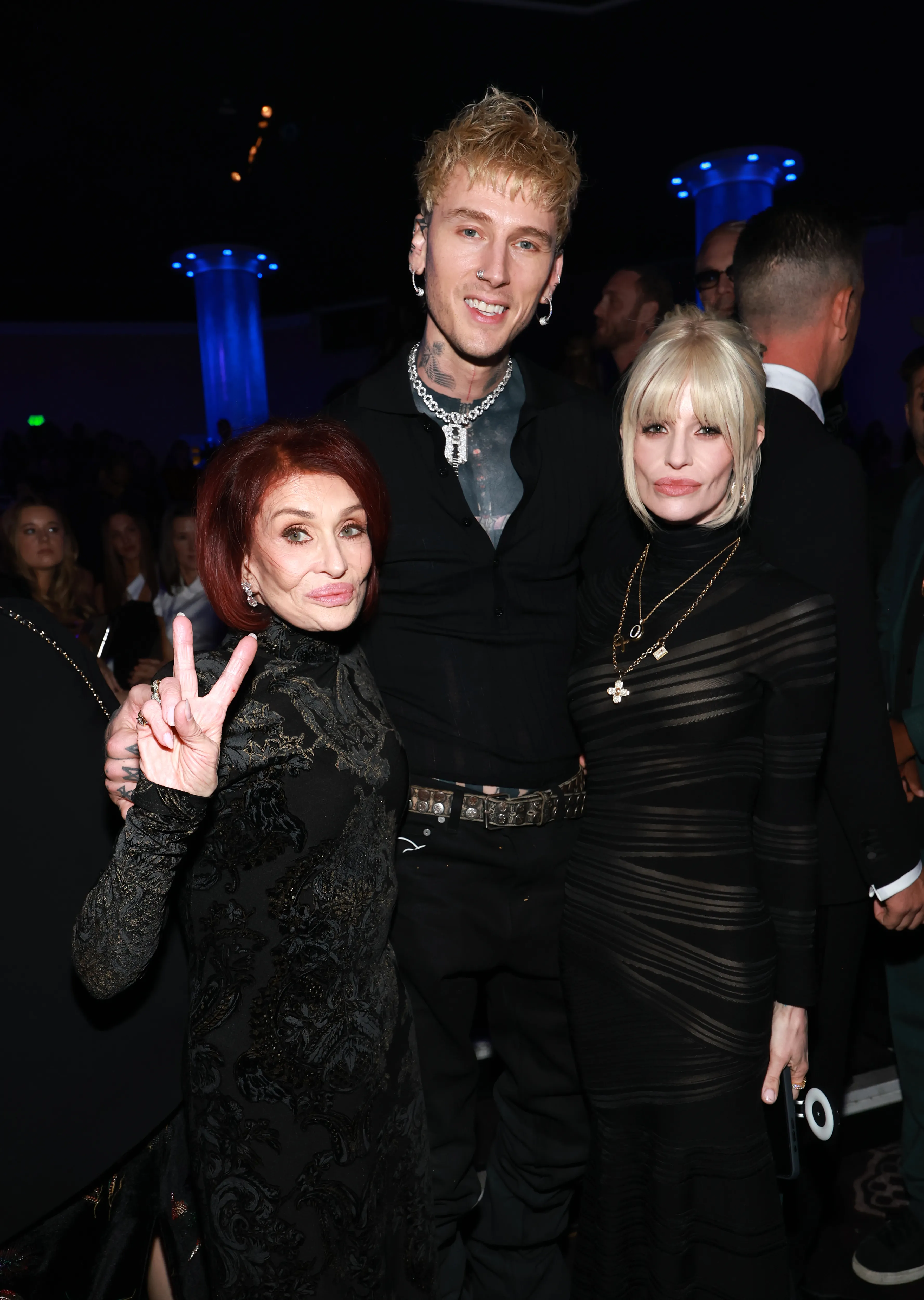 Sharon Osbourne, Machine Gun Kelly, and Kelly Osbourne at the Pre-GRAMMY Gala.