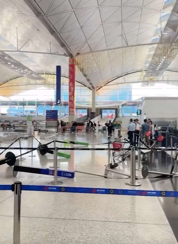 Damaged self-service check-in machines in an airport terminal.