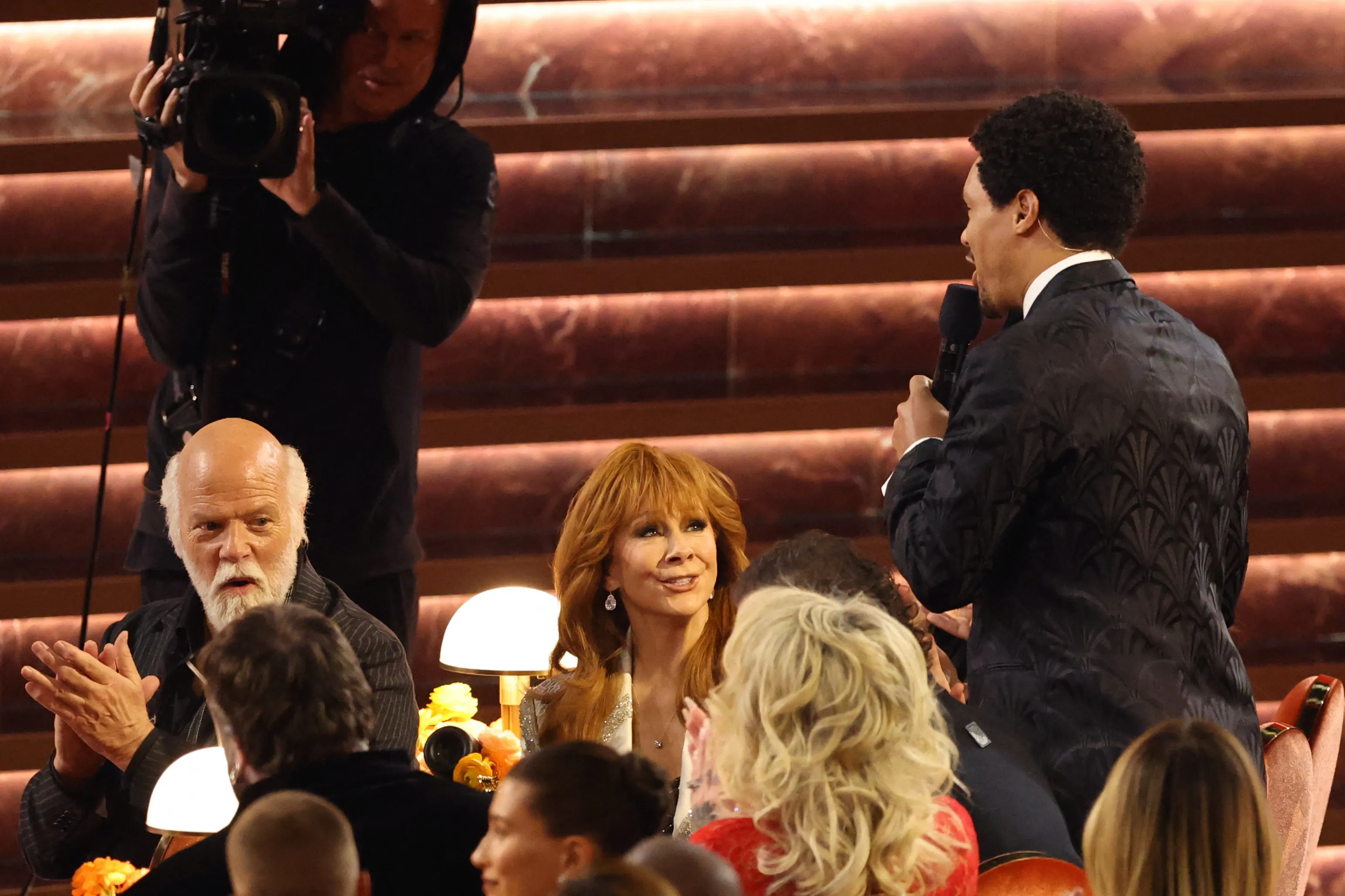 Trevor Noah at the Grammys interacting with the guests