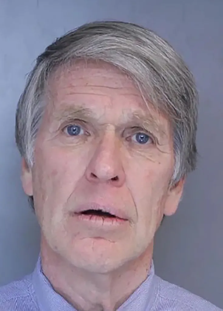 Mugshot of William Stanley, a man with gray hair and blue eyes, wearing a light blue collared shirt.