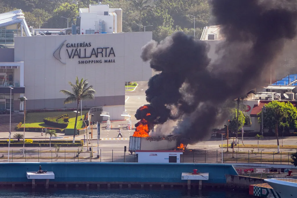 An aerial image shows smoke plumes following violent unrest after the reported killing of cartel leader El Mencho in Puerto Vallarta, Mexico, on Feb. 22, 2026.