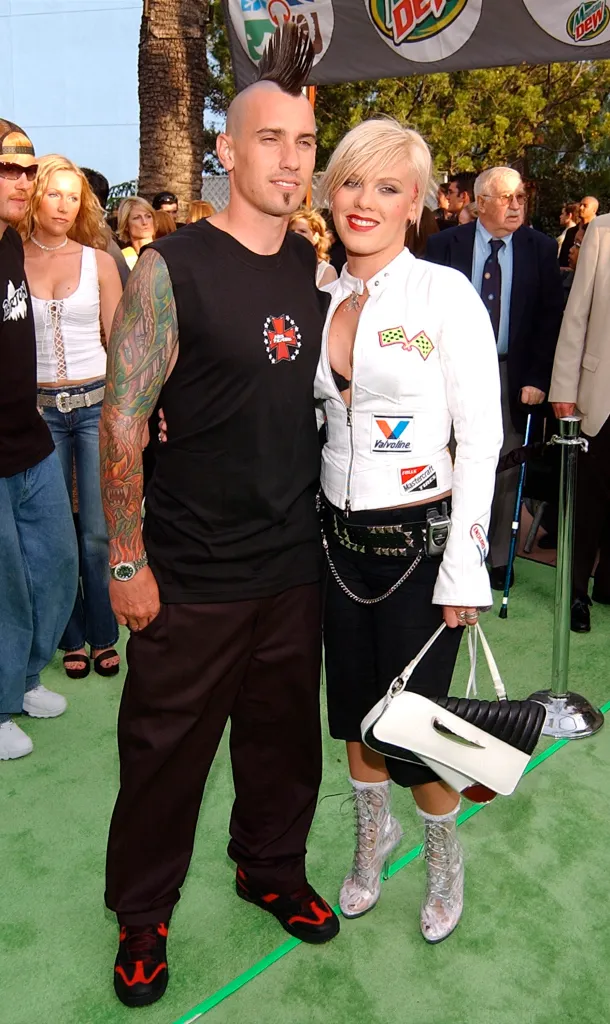 Singer Pink and professional freestyle motorcross athlete Carey Hart pose at an awards show.