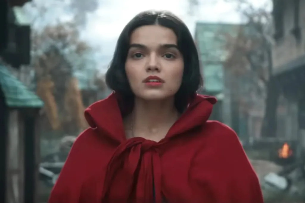Rachel Zegler as Snow White in a red cape.