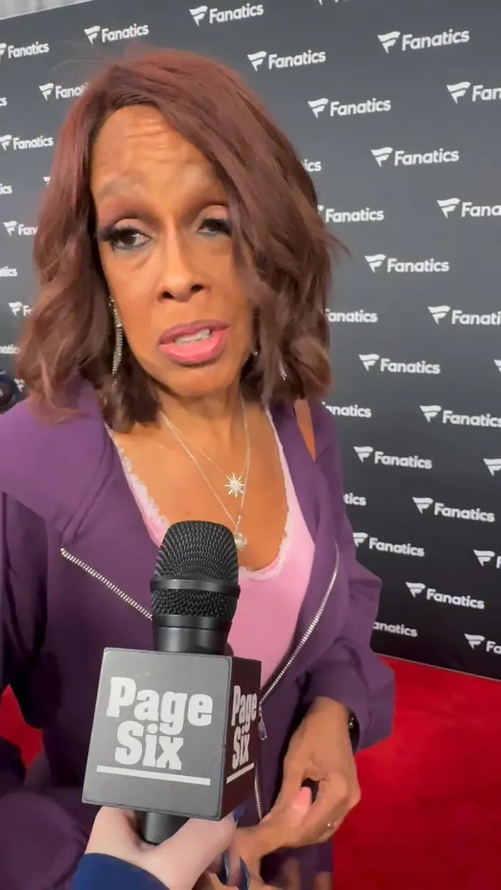 Gayle King speaking into a 