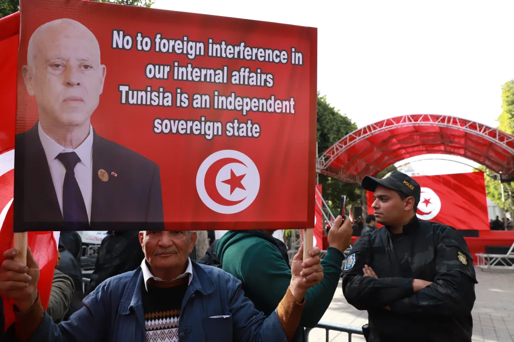 Supporters of Tunisian President Kais Saied take part in a demonstration marking the 15th anniversary of the revolution that provoked the Arab Spring, in the capital Tunis, Tunisia, Wednesday, Dec. 17, 2025.