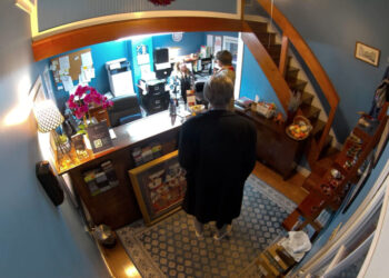 Tricked-out overcoat linked to new charges in $38,000 wine heist