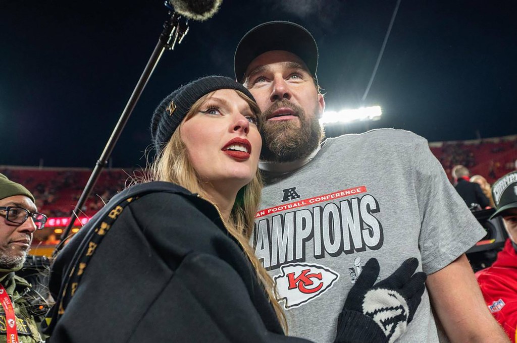 Taylor Swift celebrating with Travis Kelce, who wears a gray 