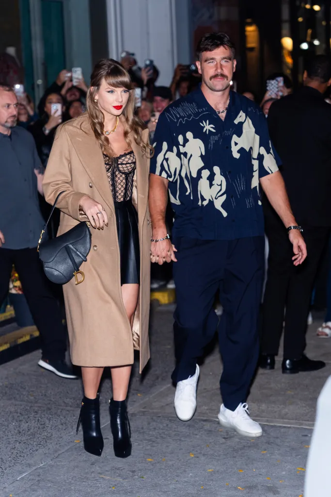 Taylor Swift (L) and Travis Kelce are seen in SoHo on October 11, 2024 in New York City.