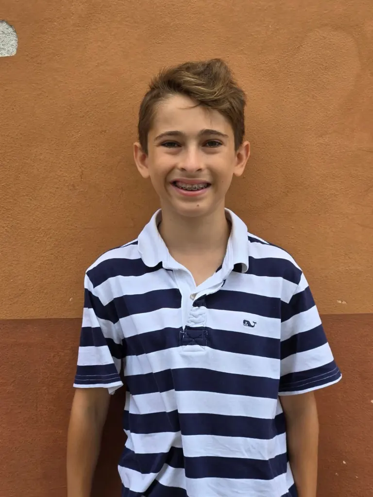 Thaddeus Giansanti smiling with braces.