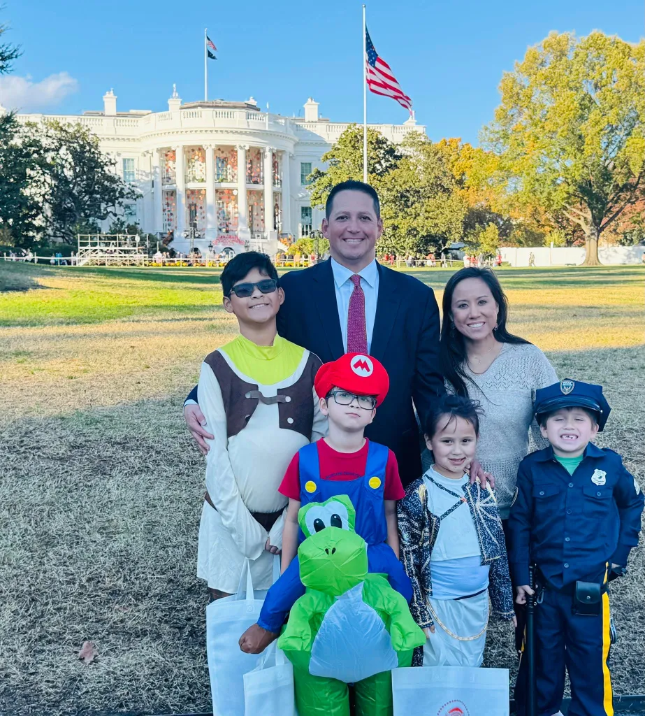Tony Gonzales, his wife Angel, and their children pose in front of the White House.