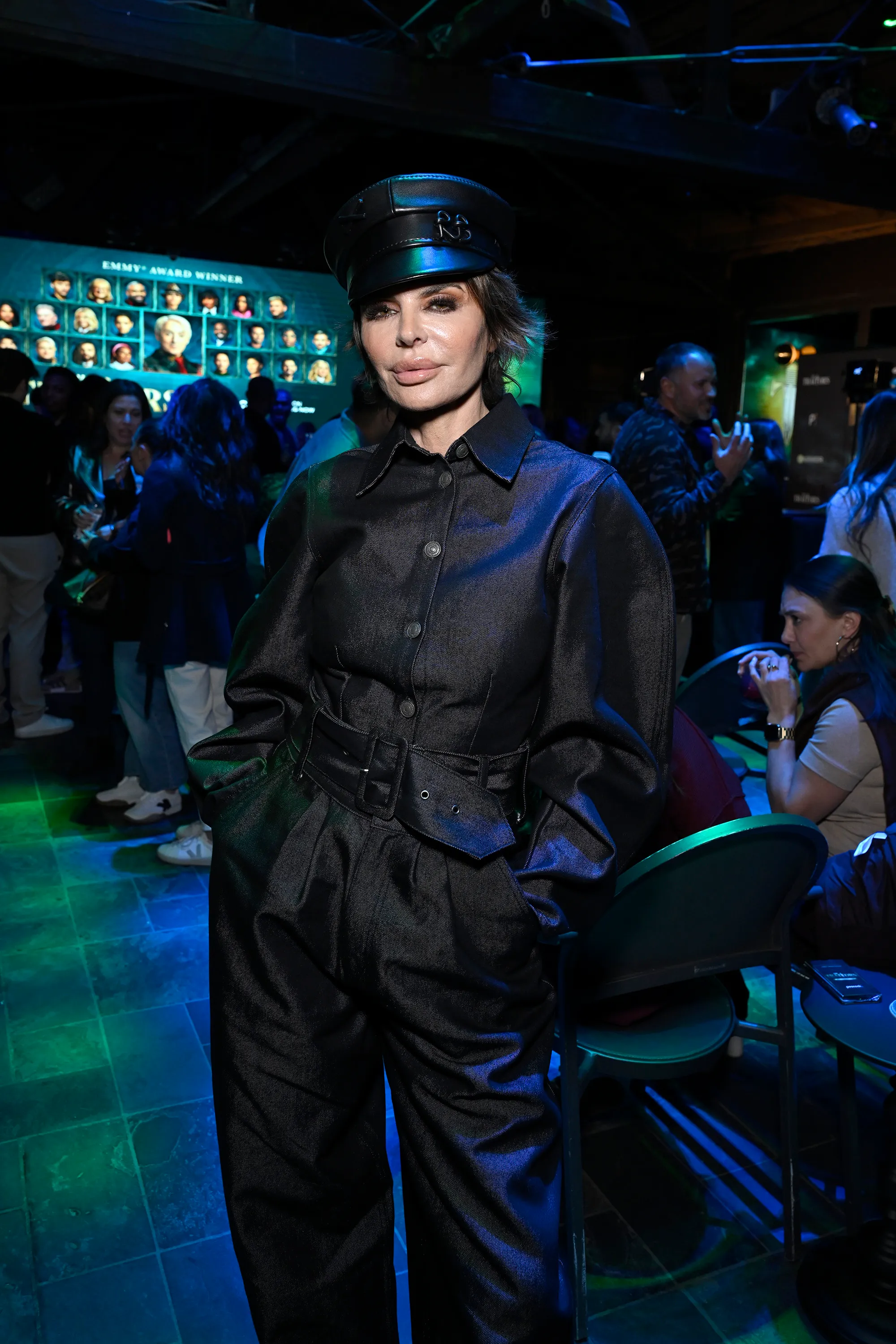 Lisa Rinna in a black denim jumpsuit and cap at The Traitors Season 4 Premiere Watch Party.