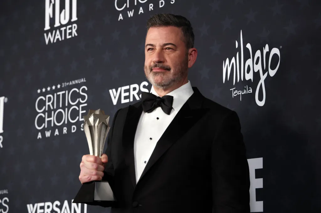 Jimmy Kimmel holding the Best Talk Show award for 