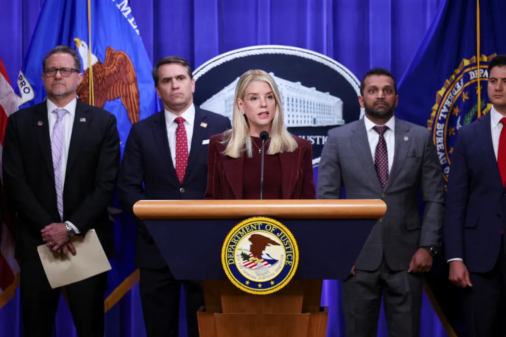 U.S. Attorney General Pam Bondi speaks at a podium during a press conference, flanked by FBI Director Kash Patel, First Assistant U.S. Attorney for the Central District of California Bill Essayli, and U.S. Ambassador to Mexico Ronald Johnson.