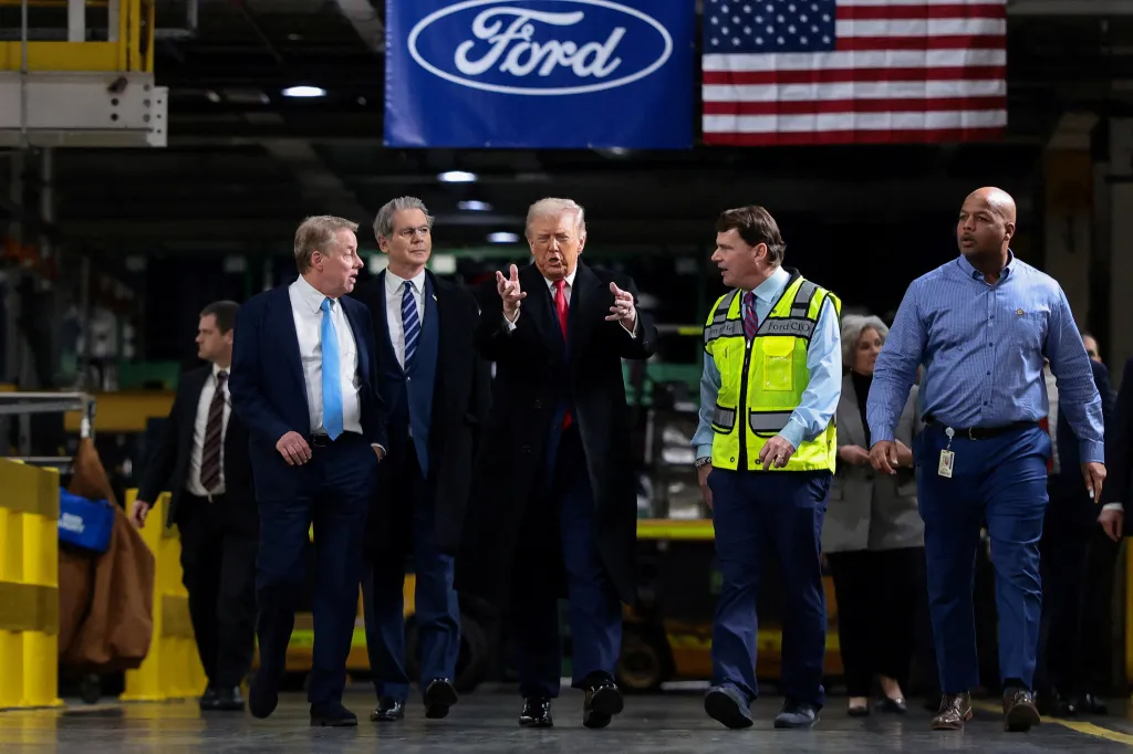 Donald Trump speaks with Bill Ford, Scott Bessent, Jim Farley, and Corey Williams at a Ford production center.