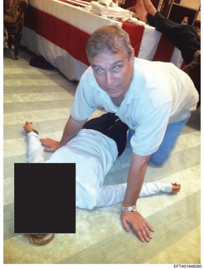 Redacted photo of Prince Andrew kneeling over an unidentified person.