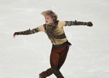 ‘Quad God’ Ilia Malinin conserves energy in Olympic debut, U.S. still leads team skate