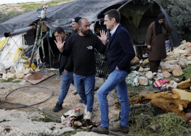 With rocks, clubs and flammable liquid, Jewish settlers descend on a Palestinian hamlet