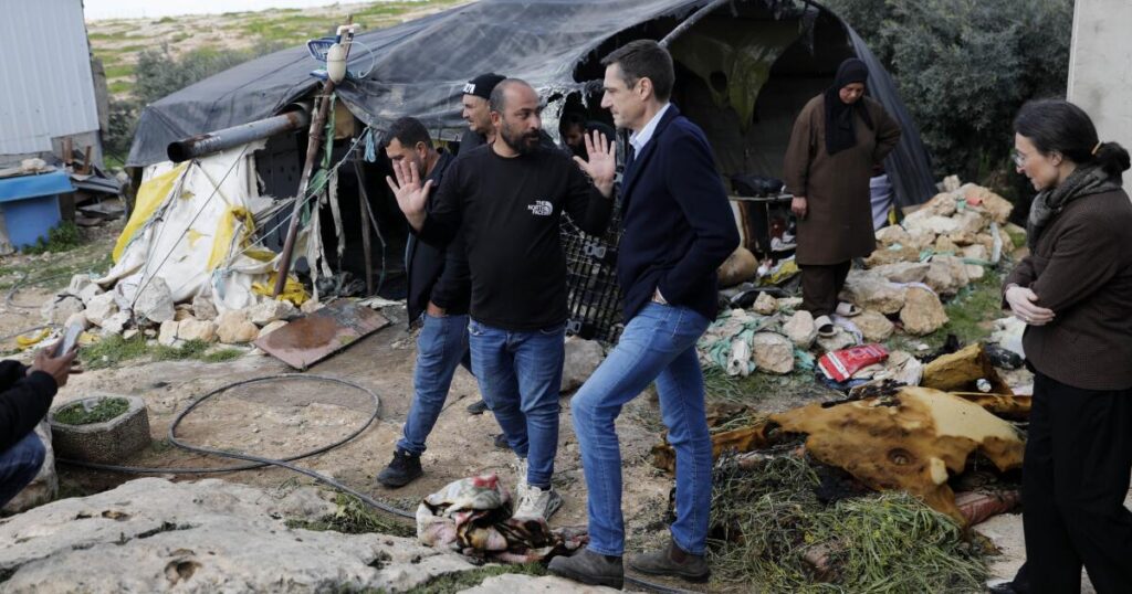 With rocks, clubs and flammable liquid, Jewish settlers descend on a Palestinian hamlet