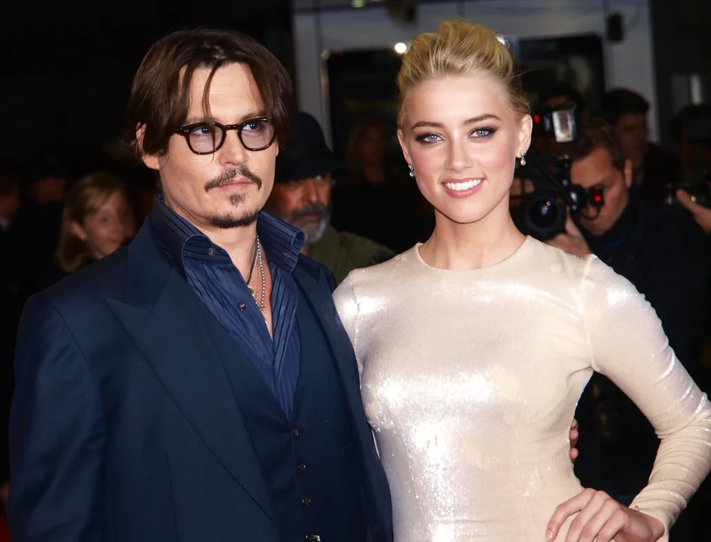 Johnny Depp and Amber Heard posing at the European Premiere of 
