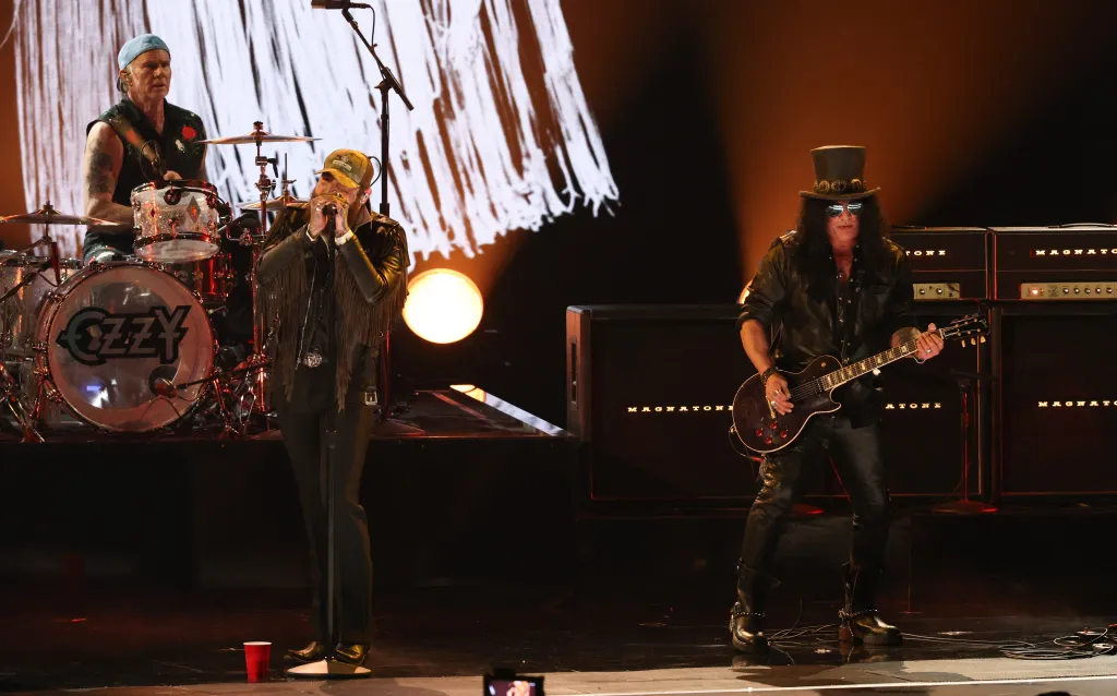 Chad Smith, Post Malone, and Slash perform a tribute to Ozzy Osbourne.