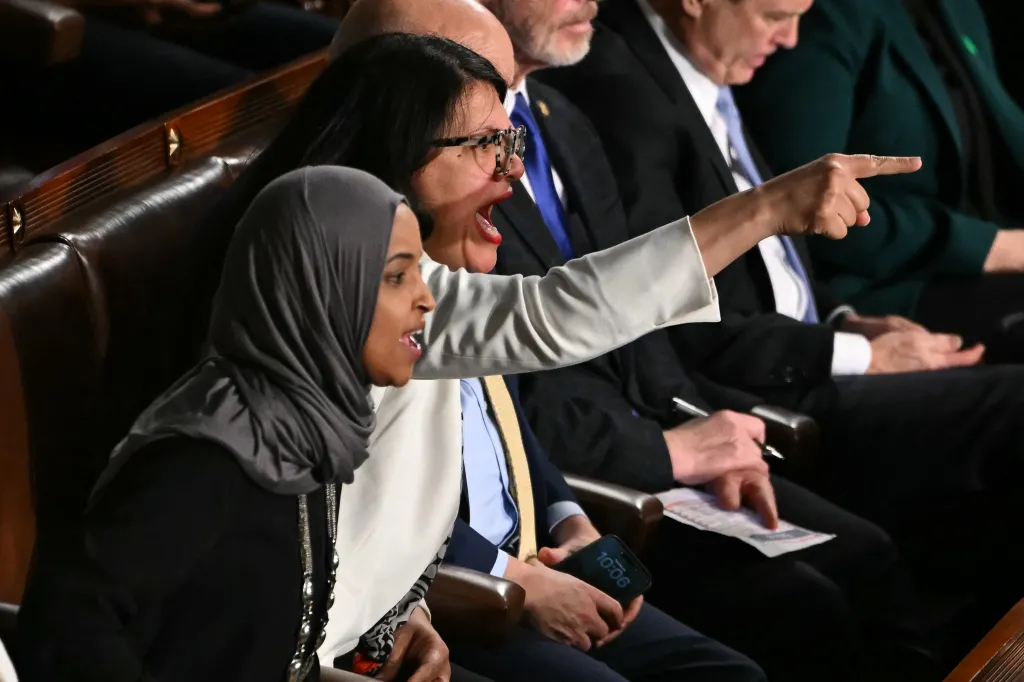Representatives Ilhan Omar and Rashida Tlaib shout during the State of the Union address.