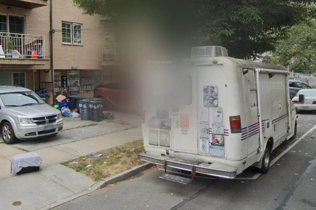 A mobile veterinarian clinic van parked on a street in front of an apartment building.