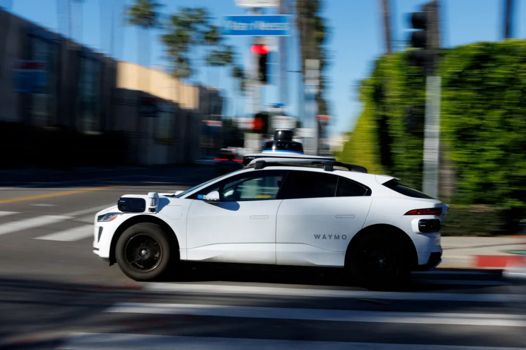 A Waymo driverless taxi drives in Hollywood, Los Angeles.